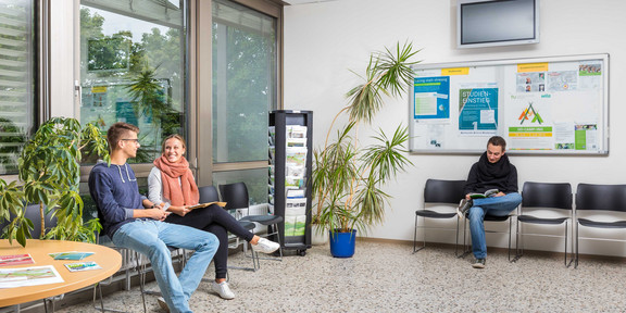 Students sitting in the waiting area of the Central Student Advisory Service